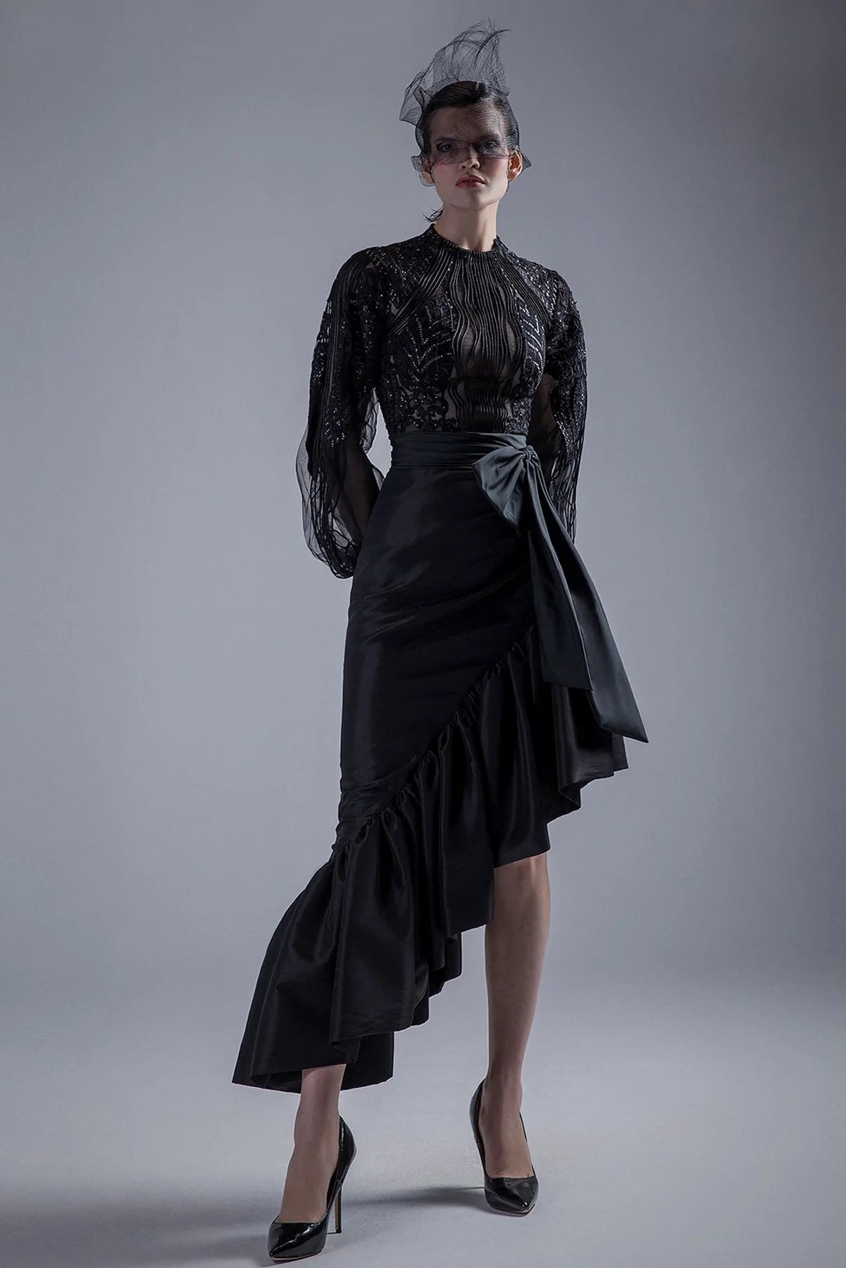 High neck beaded bodice with ruffled skirt button skirt front