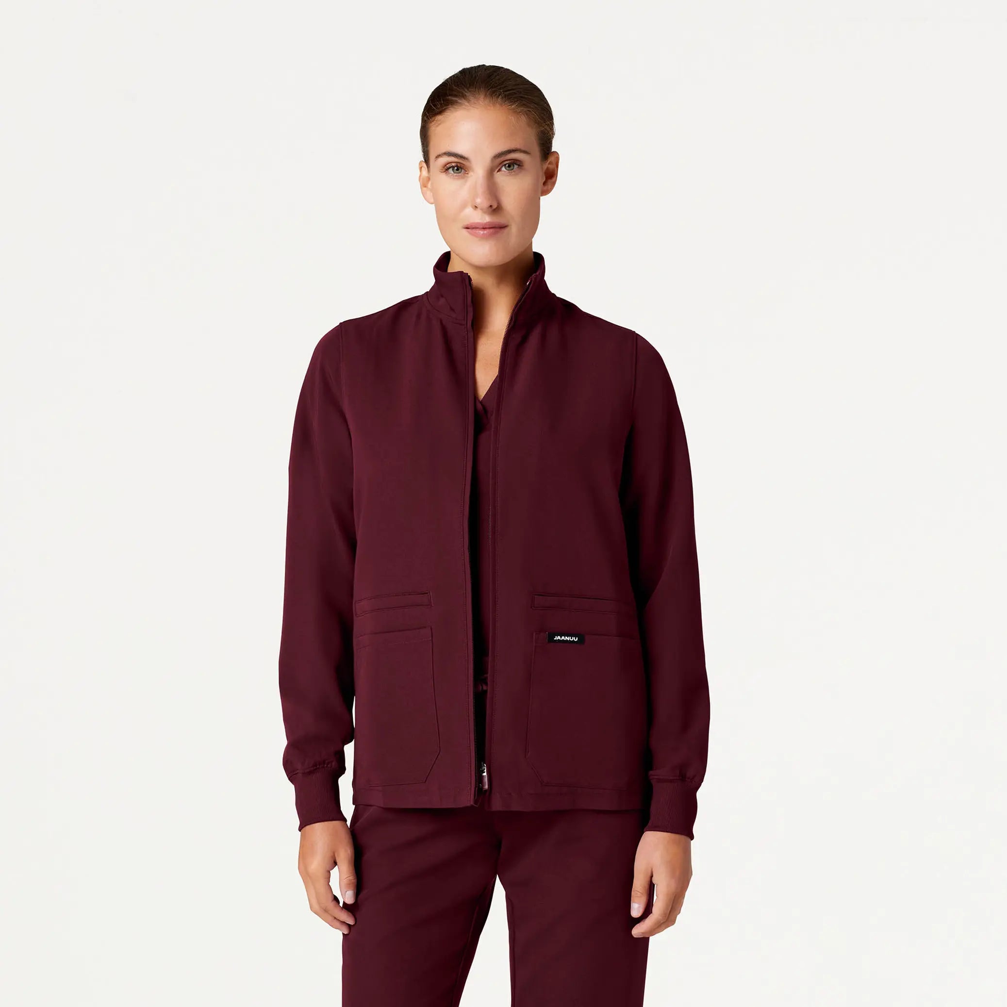 Jaanuu Women's Ceri Essential 6-Pocket Scrub Jacket - Burgundy Tiered Jacket Buttoned Jacket Zippered Jacket
